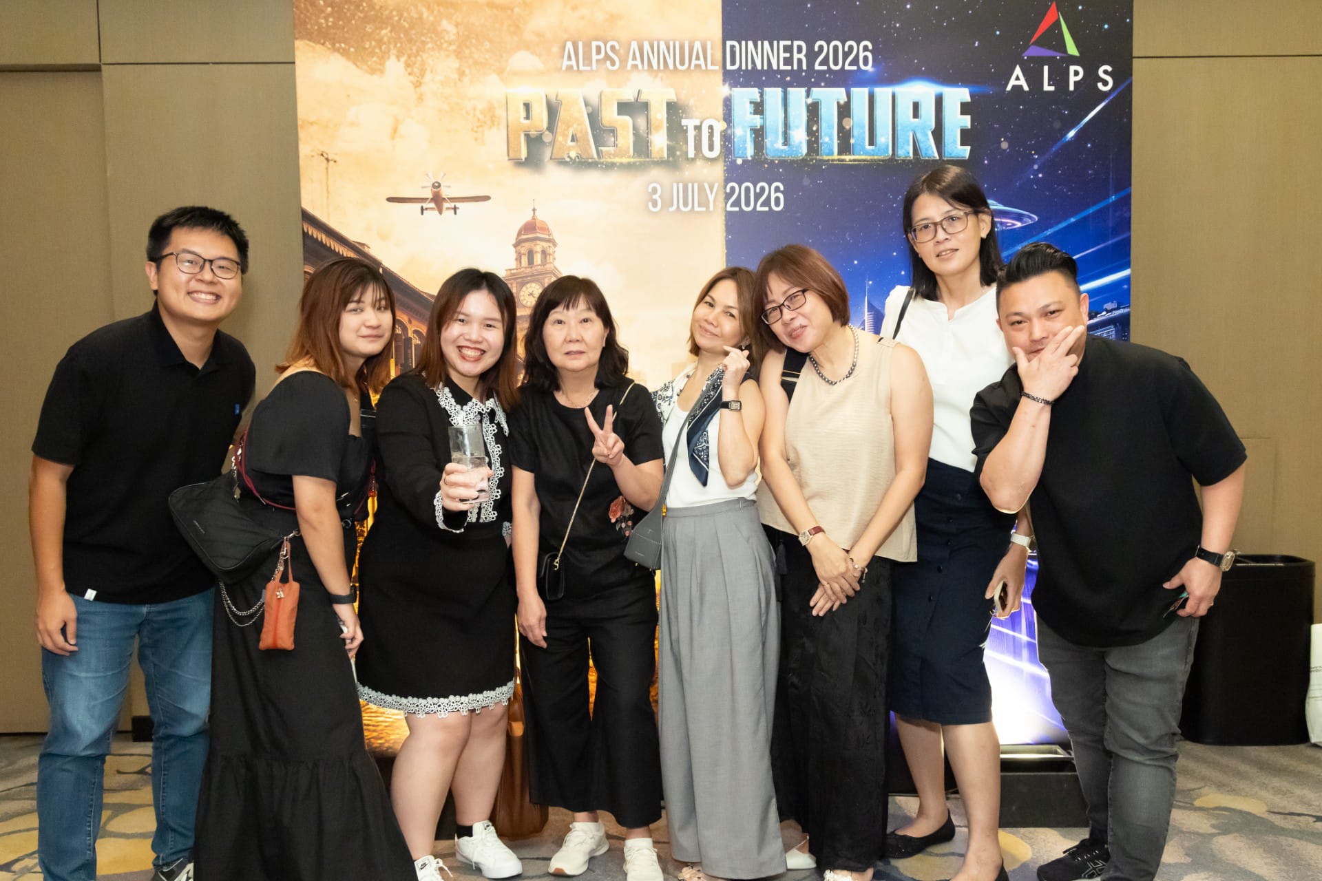Photo of 8 ALPS staff taken at ALPS Anniversary Dinner